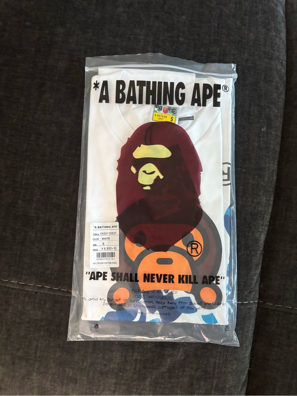 A Bathing Ape White Tee with Bold Orange Ape Graphic